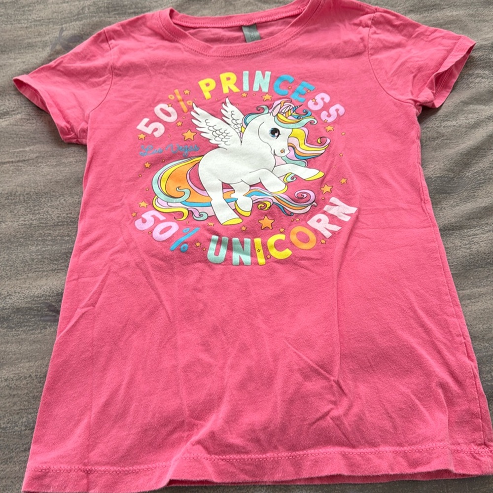 Girl’s large screen printed pink tee.  50% Princesses 50% Unicorn. Super cute.